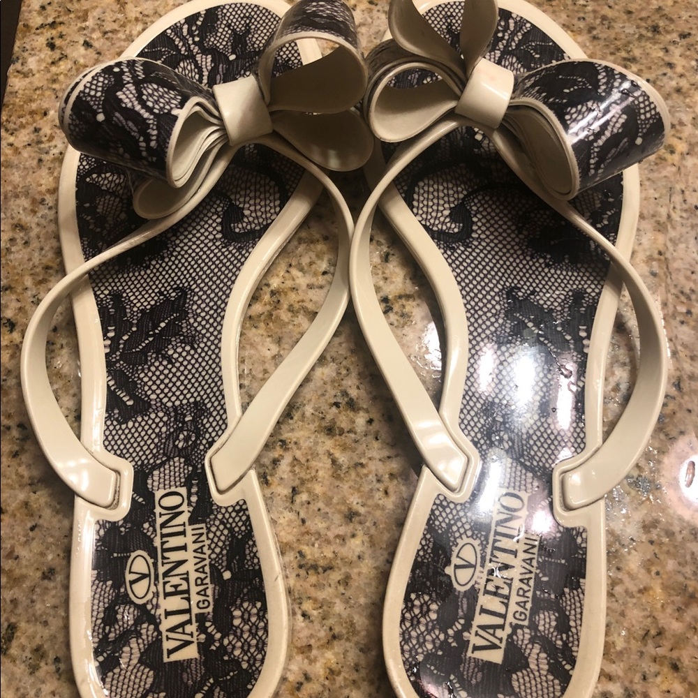 Valentino flip flops, sign of wearing